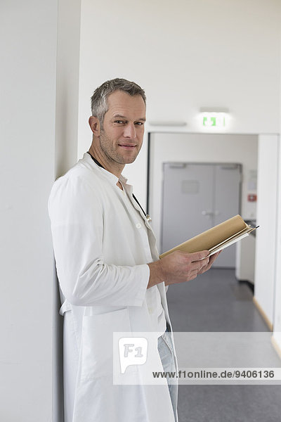 Portrait of doctor with file  smiling