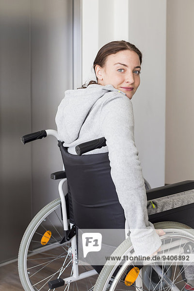Young woman using wheelchair