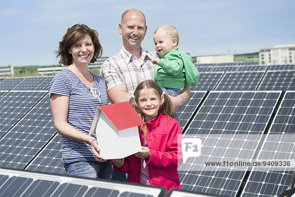 Young family two kids baby solar renewable energy