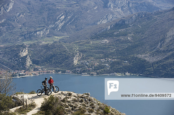 Men with mountain bikes at Lake Garda  Italy
