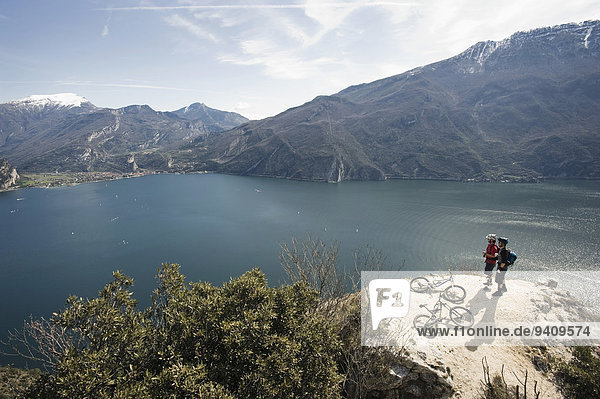 Men with mountain bikes at Lake Garda  Italy
