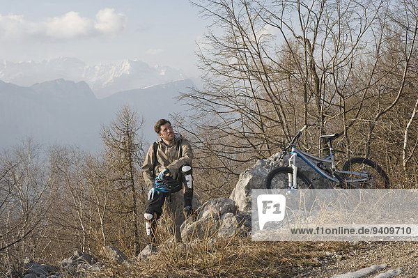 Mid adult man taking rest mountain side  Italy