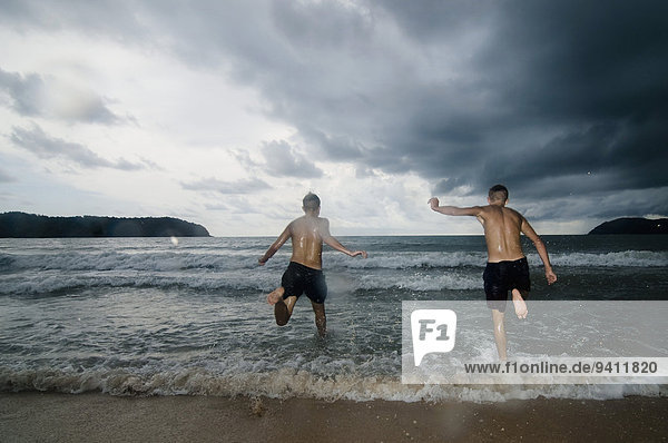 two boys at ocean  Lankawi  Malaysia
