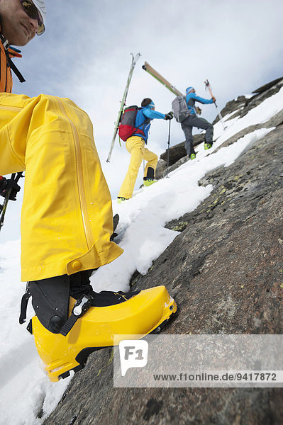 Rock climbing cross-country skiers snow