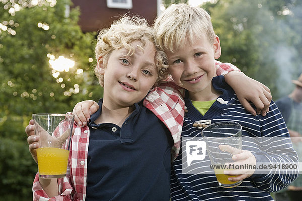 Portrait two young boys friends smiling blond