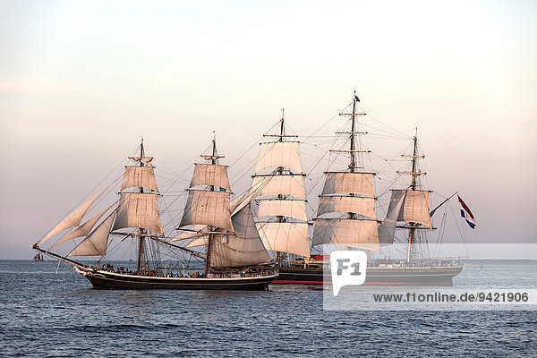 Evening sailing with the Stad Amsterdam in the foreground  Hanse Sail 2014 Warnemünde  Mecklenburg-Western Pomerania  Germany