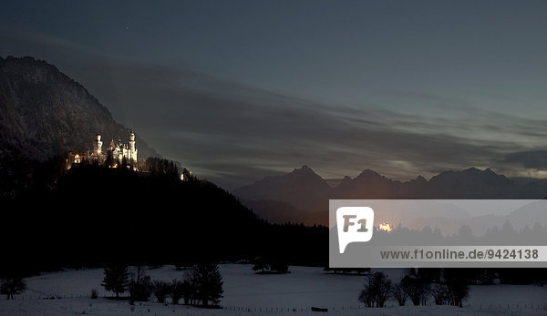 Royal palaces Neuschwanstein and Hohenschwangau in the last light of the evening  Bavaria  Germany  Europe