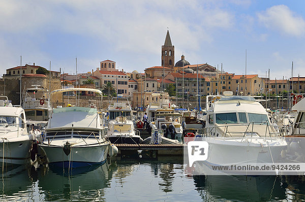 Motor yachts in the harbour  Alghero  Sassari Province  Sardinia  Italy