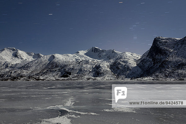 Frozen lake and mountain at night on the Lofoten Islands  Norway  Europe  PublicGround