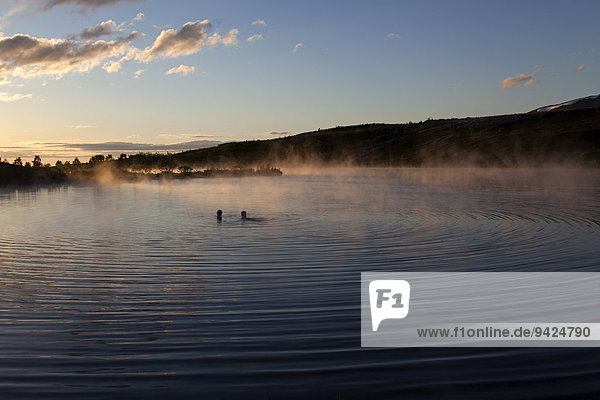 Hot spring thermal lake evening light near Husavik Iceland
