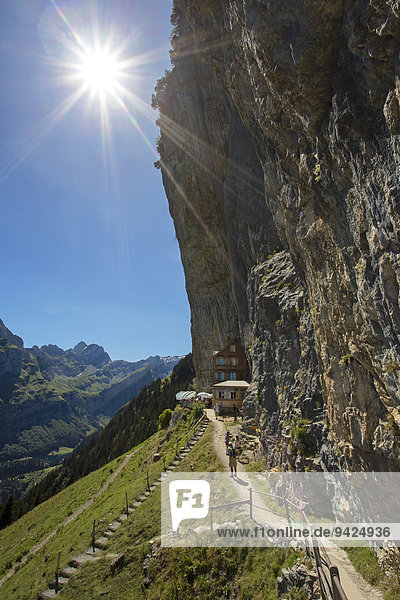 View of the Aescher mountain inn and Altmann mountain  with the sun  Alpstein mountain group  Ebenalp  Switzerland  Europe