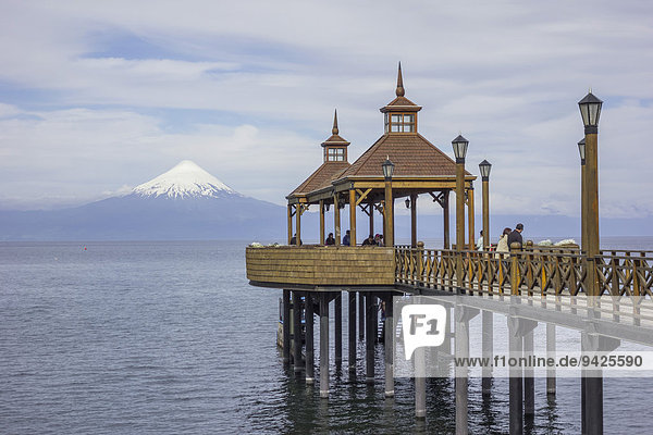 Bridge and viewing platform in the Llanquihue lake  volcano Osorno at the back  Frutillar  Los Lagos Region  Chile