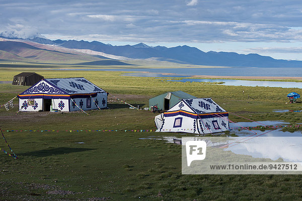 Modern colourful Tibetan picnic tents on the banks of the holy Namtso or Lake Nam  Heavenly Lake  4718 m  Damchung  Tibet  China