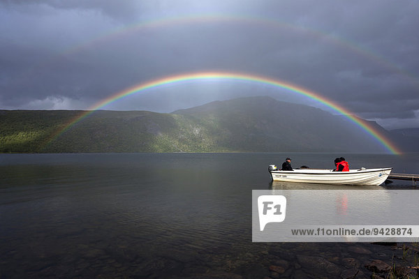 Rainbow and boat on Lake Teusajaure  Kungsleden  The King's Trail  Lapland  Sweden  Europe