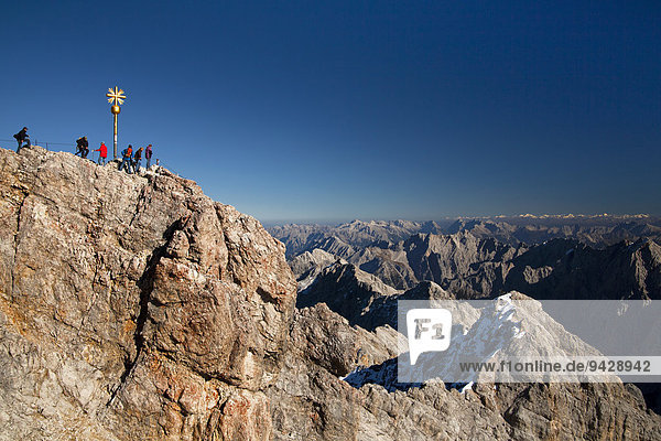 View towards the summit cross of Zugspitze Mountain in fine weather in the German Alps  Germany  Europe
