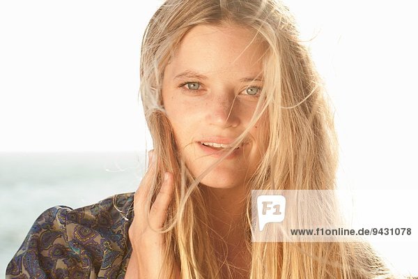 Close up portrait of young woman at the coast  Malibu  California  USA