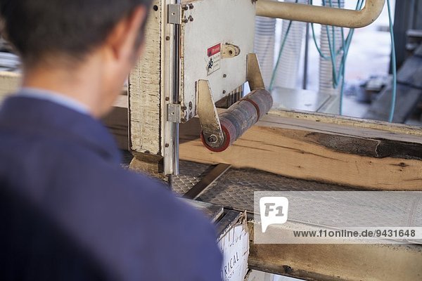 Carpenter working on wood flooring in factory  Jiangsu  China