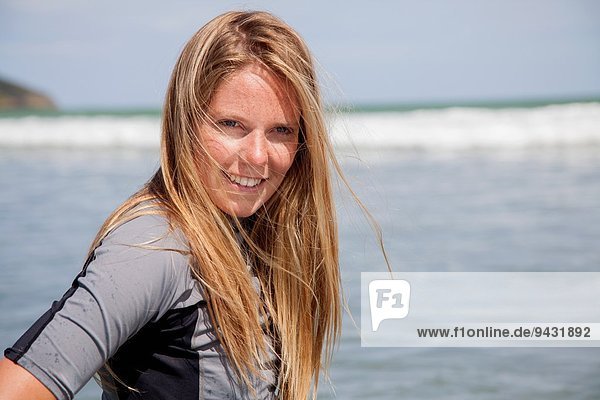 Portrait of young woman wearing wetsuit