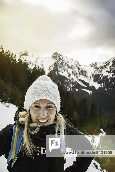 Portrait of young woman in mountains  Hundsarschjoch  Vils  Bavaria  Germany