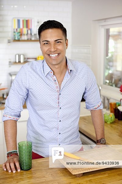 Mid adult man in kitchen  portrait