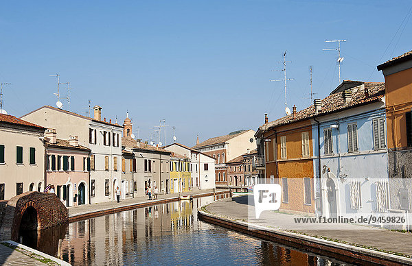 Houses on the canal  Via Agatopisto  Ponte dei Sisti on the left  Comacchio  Ferrara  Emilia Romagna  Italy  Europe