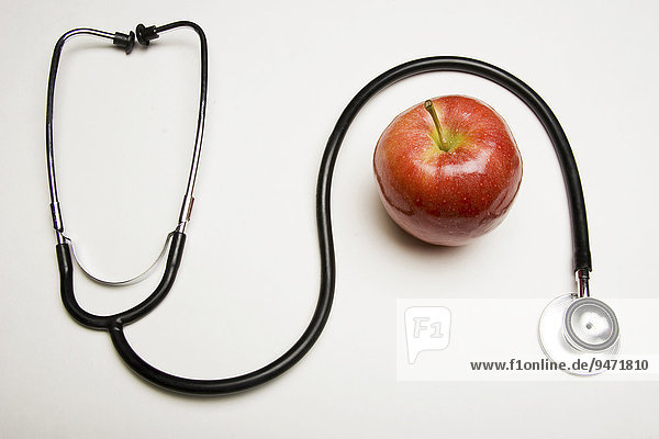 Stethoscope and red apple concept: An apple a day keeps the doctor away