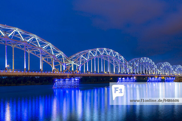 Railway bridge  Dzelzce?a tilts  at dusk  blue hour  over the Daugava river or Western Dvina  Riga  Latvia  Europe