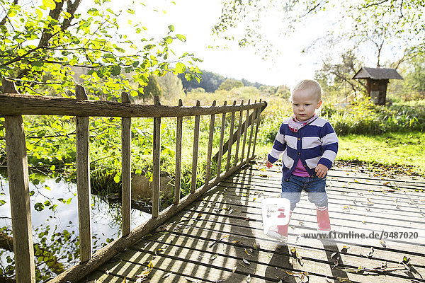 Toddler  18 months  playing in the garden