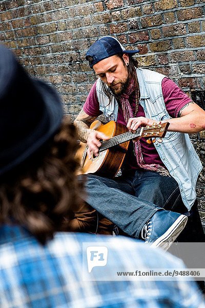 Musician at Brick Lane in East London  England  UK.