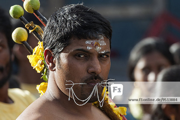 Local man at a Hindu festival  portrait  near Mahebourg  Mauritius  Africa