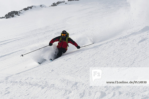 Downhill on skis from Kavriktinden  Lyngsalpene  Lyngen  Troms  Norway  Europe