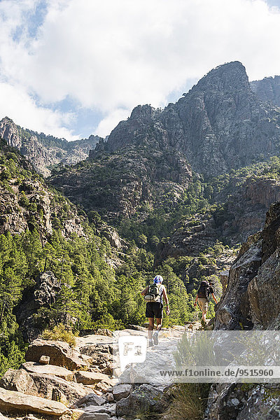 Two hikers in the mountains  Refuge de Carrozzu  Corsica  France  Europe