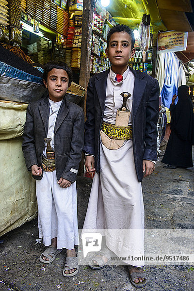 Two boys with their djambas at the spice market in the old city  Sana'a  Yemen  Asia
