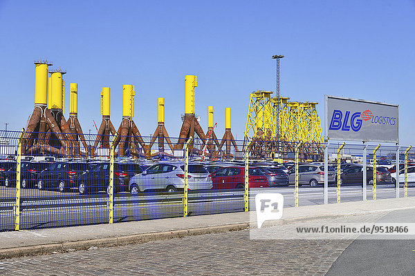 New cars  components for offshore wind turbines in the back  port  Bremerhaven  Bremen  Germany  Europe