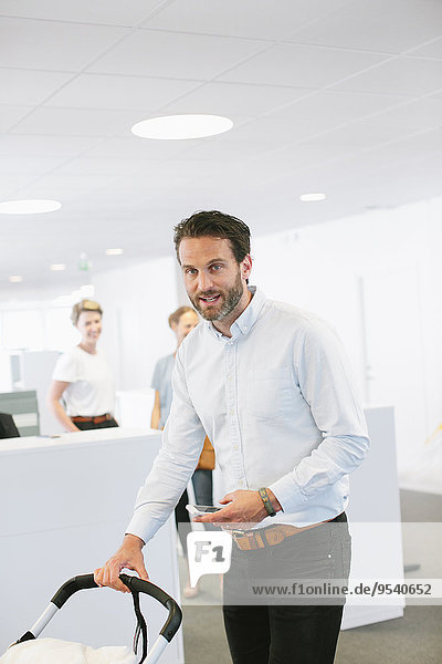 Man with buggy in office