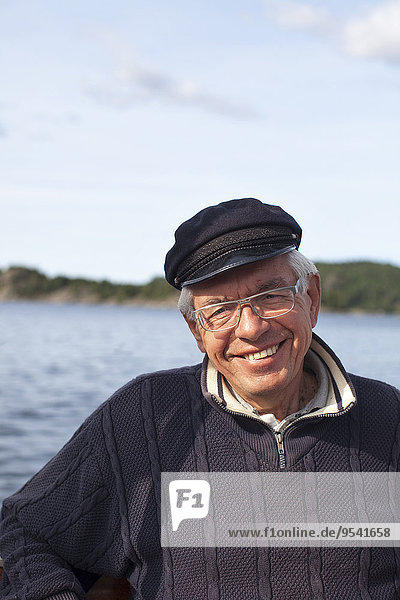 Portrait of senior man at sea
