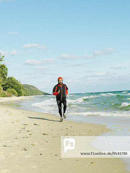 Man jogging on beach