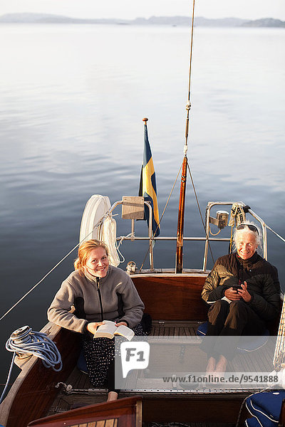 Grandmother and granddaughter on boat