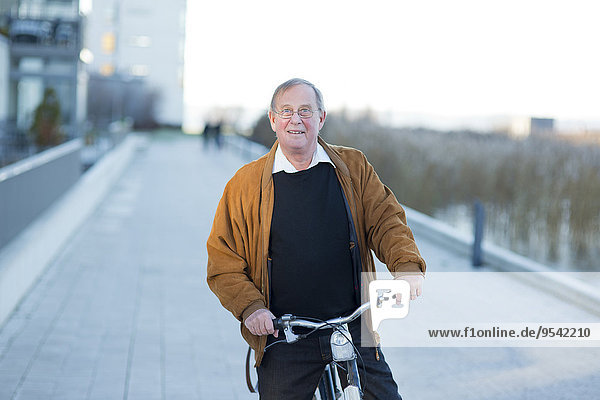 Senior man cycling