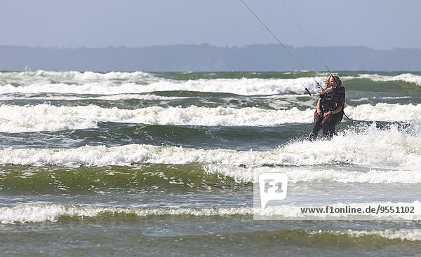 France  Bretagne  Finistere  father and daughter kitesurfing