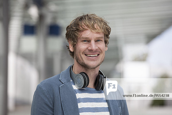 Portrait of smiling man with headphones