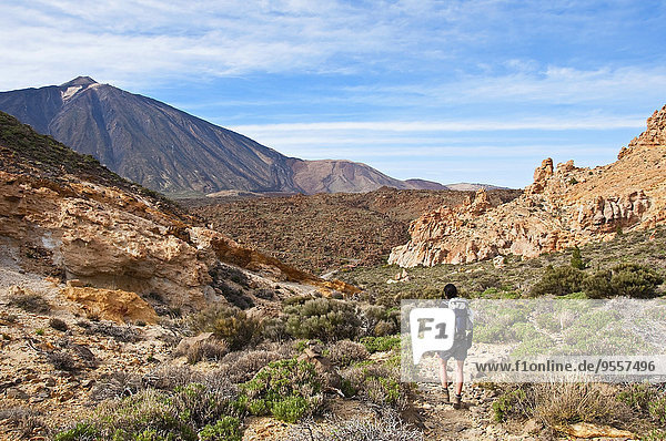 Spain  Canary Islands  Tenerife  Roques de Garcia  Mount Teide  Teide National Park  Female hiker in the Caldera de las Canadas