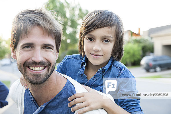 Father and son together outdoors  portrait