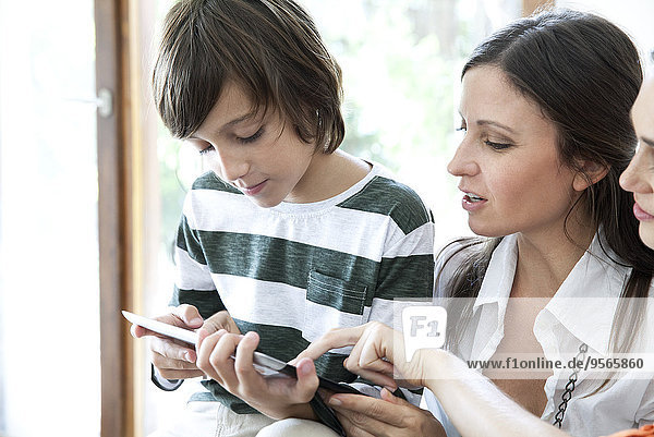 Family using digital tablet together