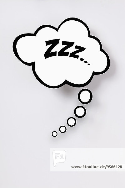 Snoring sign in thought bubble against gray background