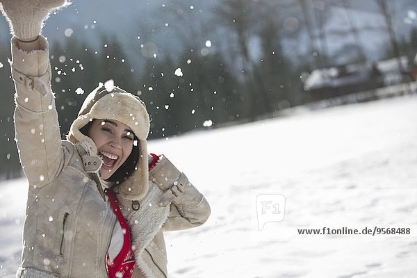 Portrait of exuberant woman in snow