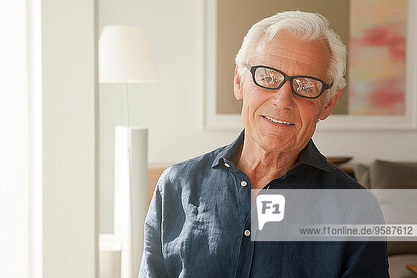Portrait of smiling senior man wearing glasses