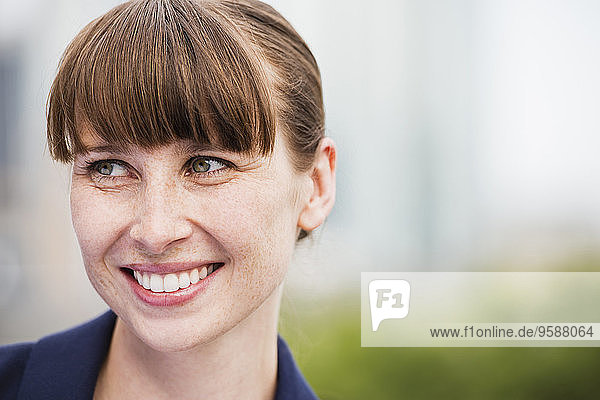 Portrait of smiling woman with freckles