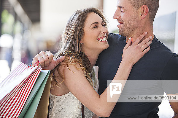 Happy couple on a shopping spree