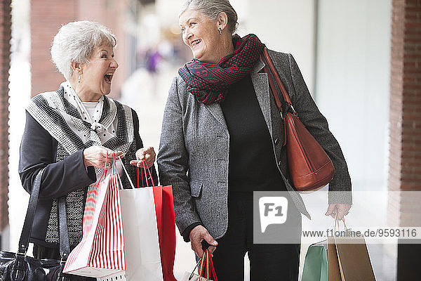 Two senior women on shopping trip